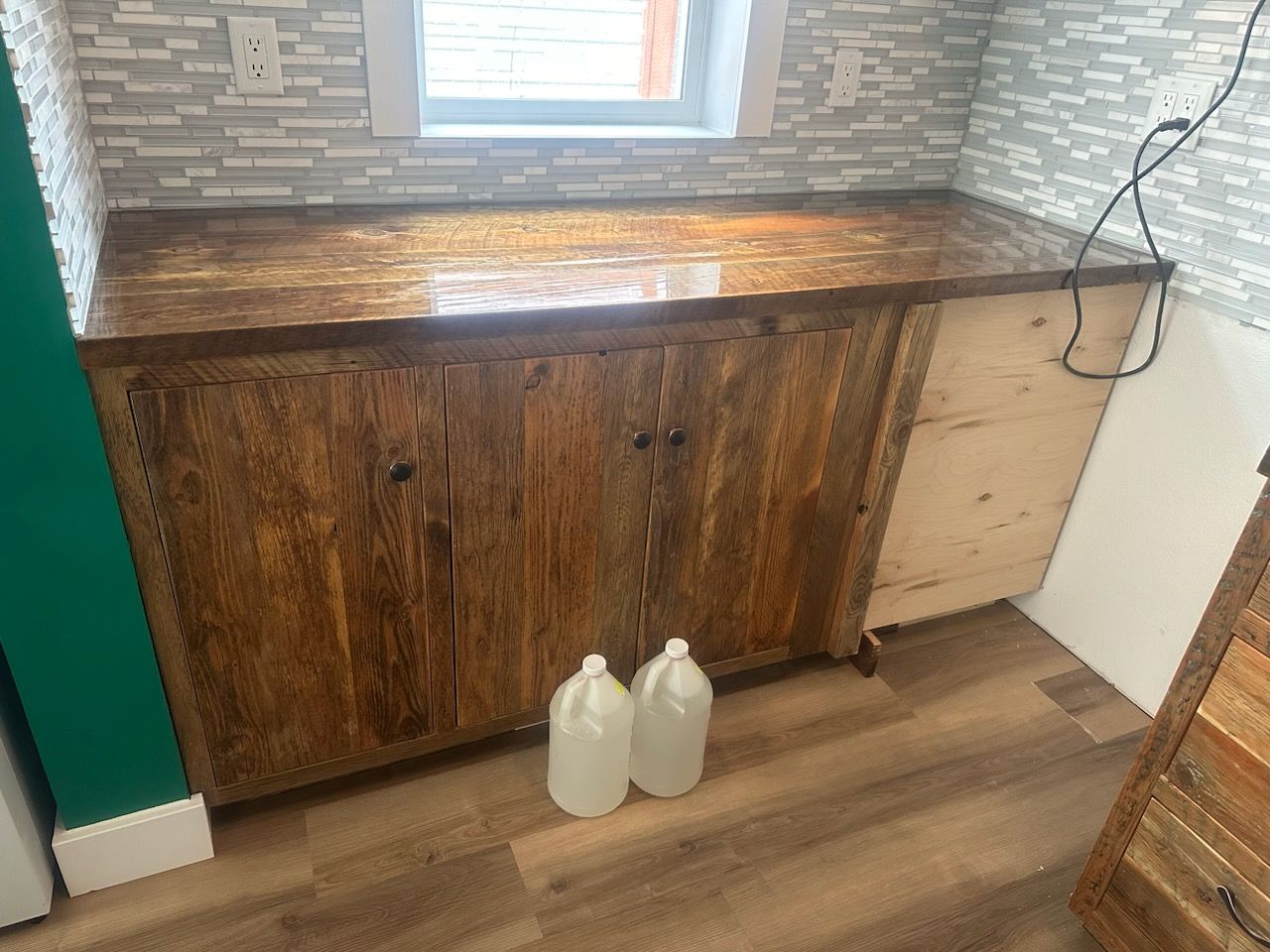 Reclaimed-wood cabinets, countertop and tile backsplash
