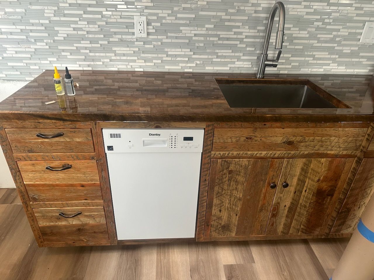 Cabinets, drawers, sink and new flooring